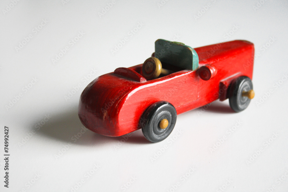Fototapeta premium AUTOMOBILE GIOCATTOLO DI LEGNO