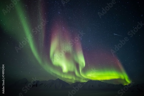 Northern Lights above the Arctic mountains and glacier