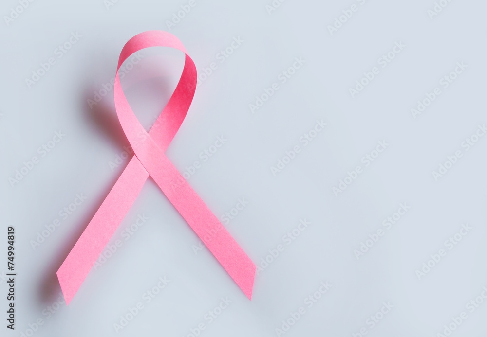 Pink breast cancer ribbon on grey background Pink breast cancer ribbon on grey background