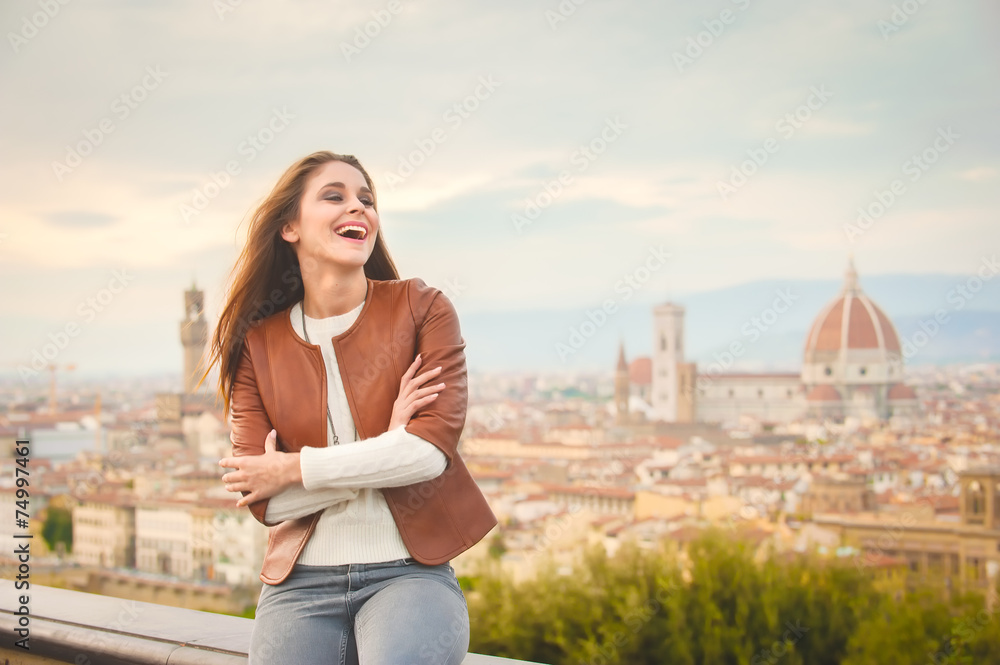 Beautiful girl impressed view the panorama of Florence in autumn