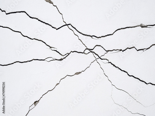 cracks on concrete wall creating lines