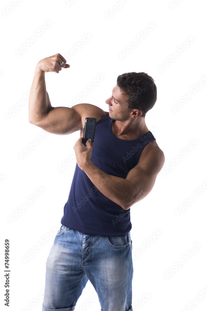Strong muscular man flexing his arm muscles Strong muscular man flexing his arm muscles
