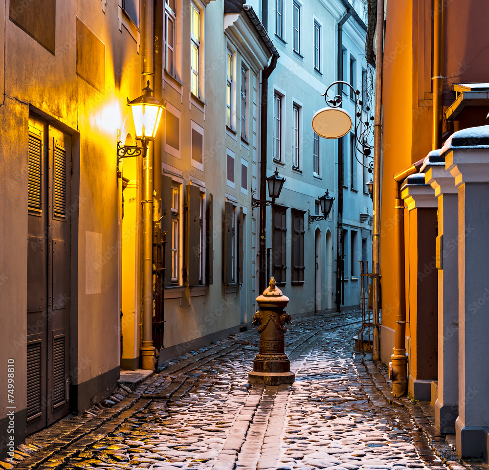 Fototapeta Narrow medieval street in old Riga city, Latvia, Europe