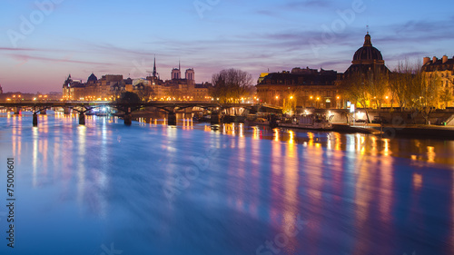 Seine river and Old Town of Paris (France) at night