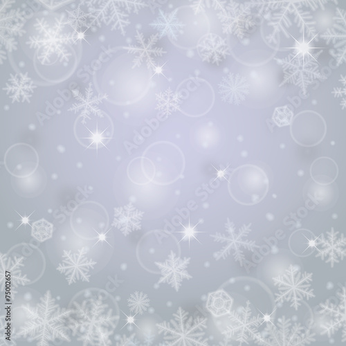 Abstract ligh christmas background with snowflakes.
