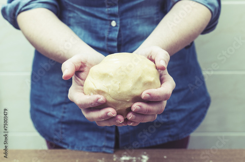 Woman kneading, baking cookies, pizza or bread