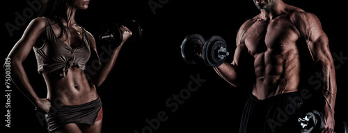 strong young couple working out with dumbbells. Shot in studio o #75003885