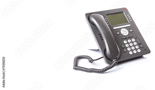 Modern desktop telephone over white background 