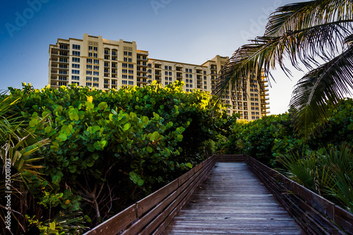 Boardwalk trail and hotel on Singer Island, Florida.
