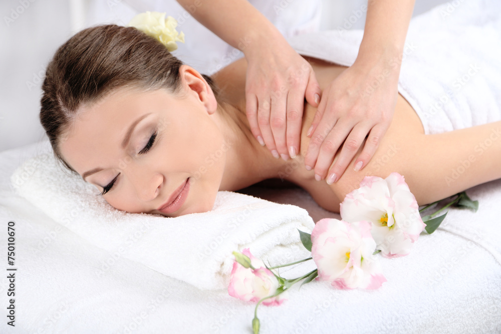 Beautiful young woman having massage in spa salon Beautiful young woman having massage in spa salon