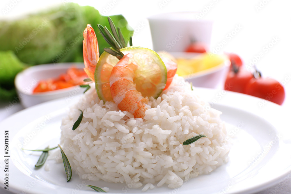 Boiled rice with shrimps served on table, close-up Boiled rice with shrimps served on table, close-up