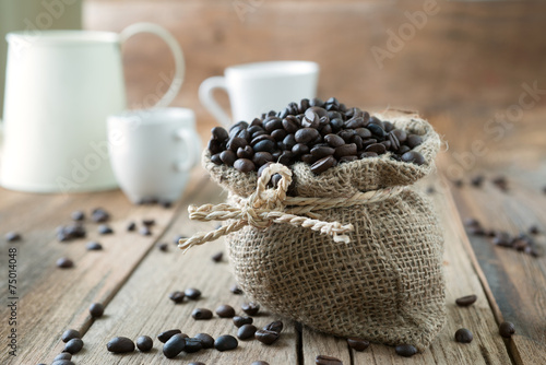 Coffee beans roasted in jute sack photo