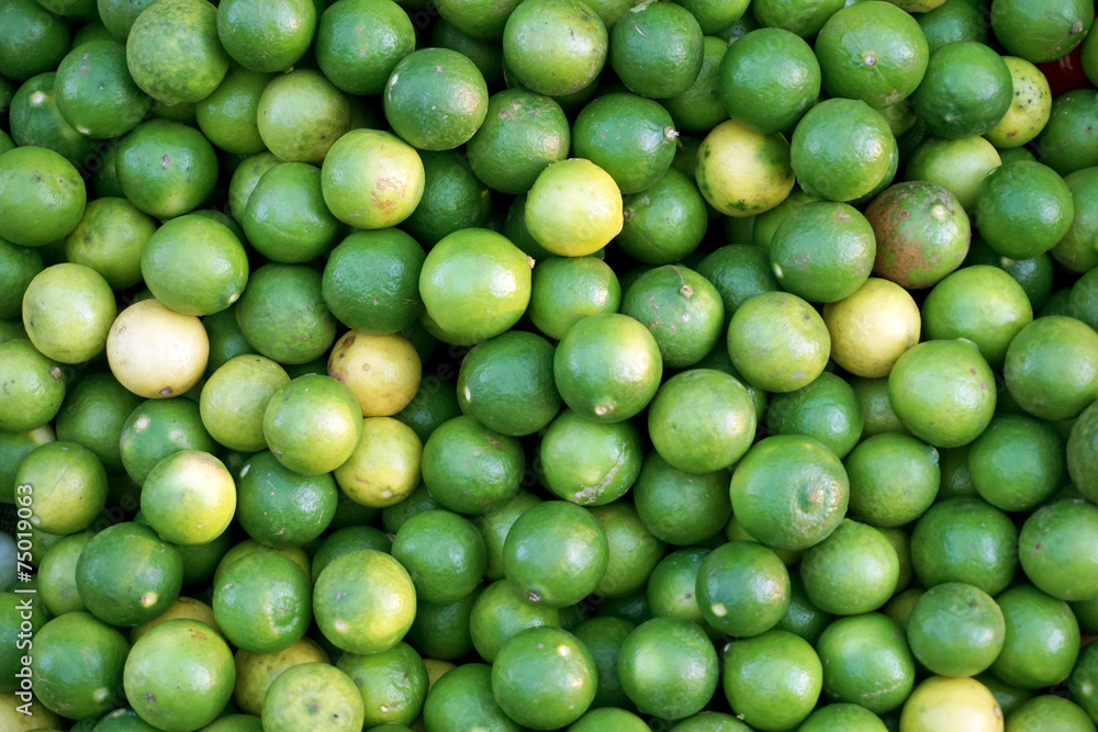 Fresh and green lemon at the market for background Fresh and green lemon at the market for background