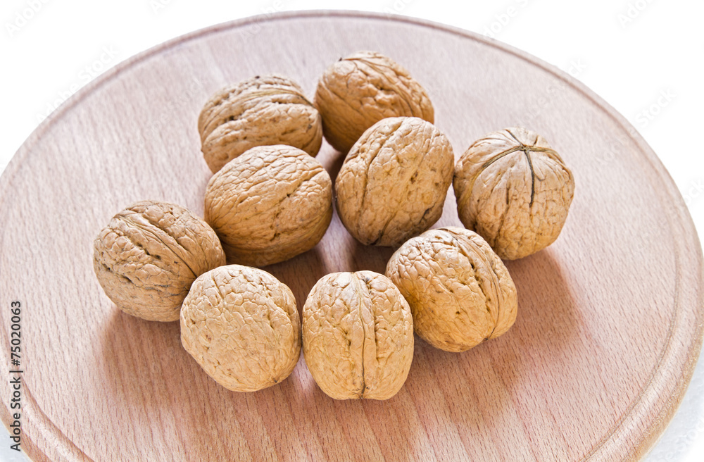 Walnuts on rustic wooden table Walnuts on rustic wooden table