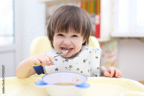funny 2 years boy eating soup