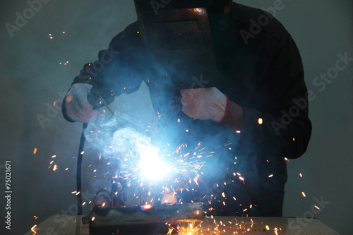 worker welding steel .