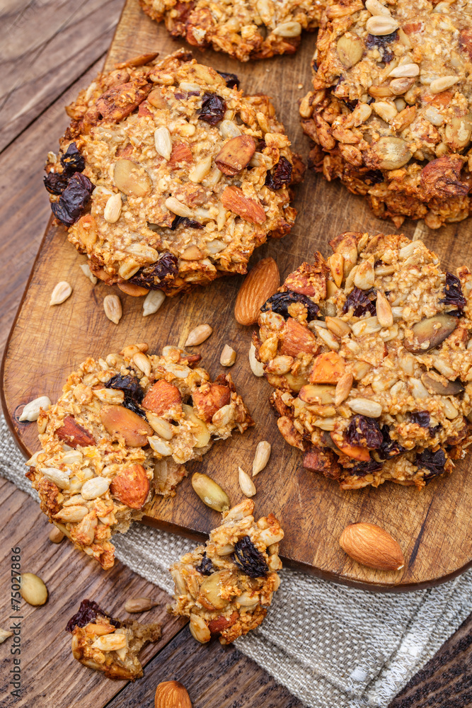 Fototapeta premium Homemade oatmeal cookies with seeds and raisin