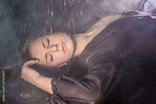 Portrait of the girl under drops 