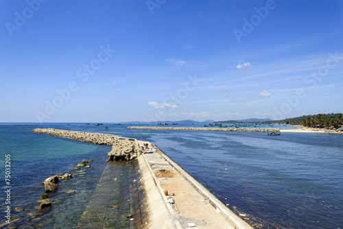 Jetty with blue sea