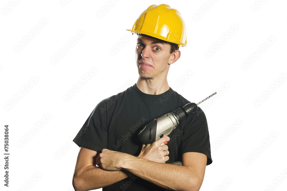 Worker holding electric drill and wearing hard hat Worker holding electric drill and wearing hard hat
