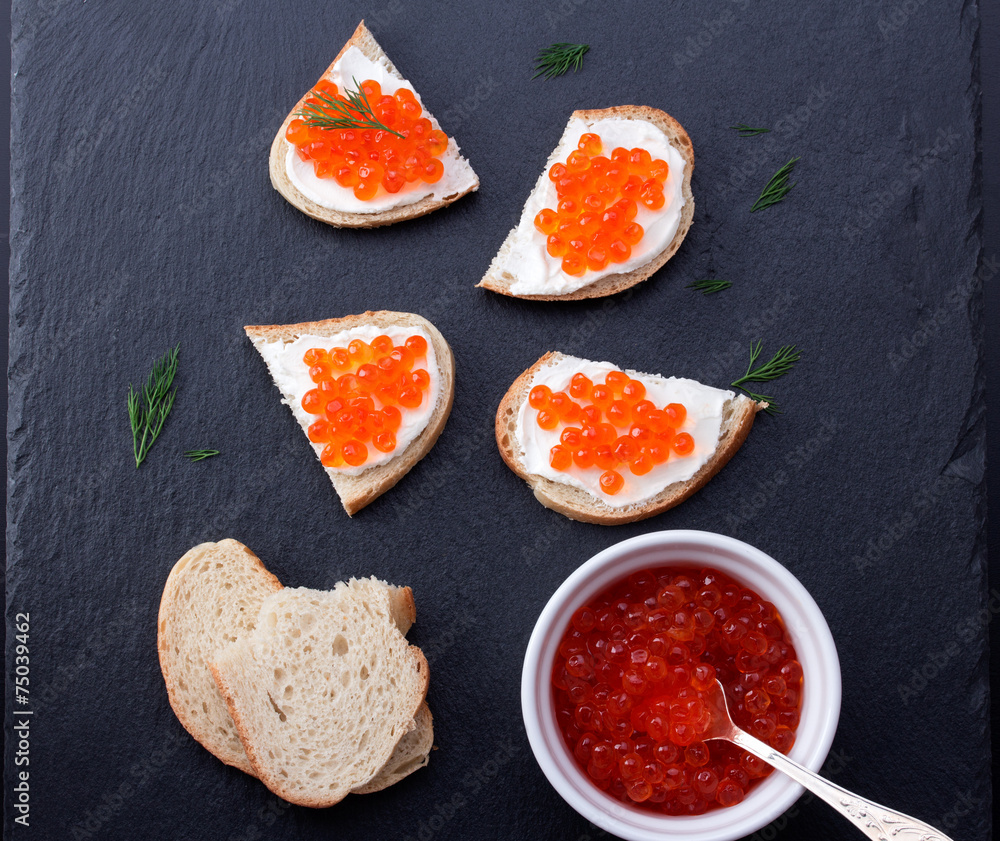 Bread with fresh cream cheese and red caviar Bread with fresh cream cheese and red caviar