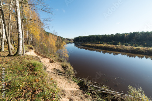 scenic autumn colored river in country