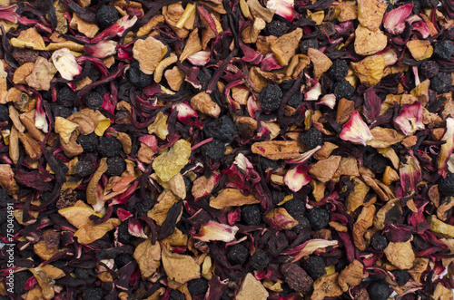 aromatic black dry tea with fruits and petals, isolated on white © Olga Kovalenko