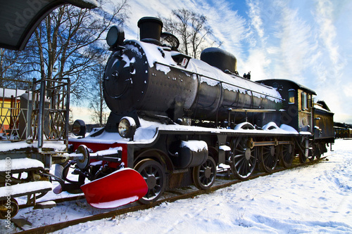Old steam locomotive in winter