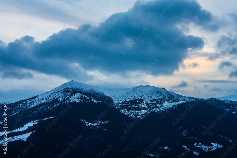 Winter snow covered mountain peaks in Europe.