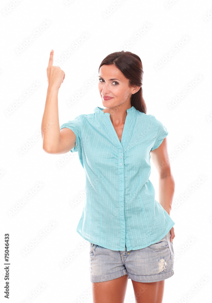 Lovely lady in short jeans pointing up Lovely lady in short jeans pointing up
