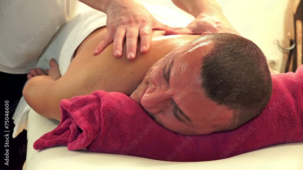 Massaging a man in beauty and spa center Massaging a man in beauty and spa center