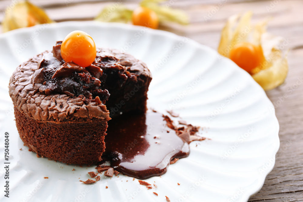 Hot chocolate pudding with fondant centre on plate, close-up Hot chocolate pudding with fondant centre on plate, close-up