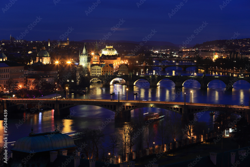 Winter night Prague City with its Bridges above River Vltava