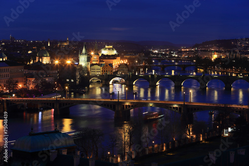 Winter night Prague City with its Bridges above River Vltava