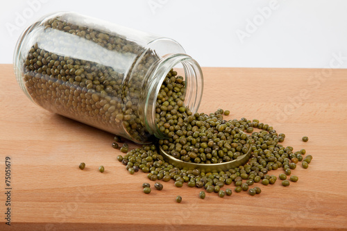 Mung beans in  jar on wood table