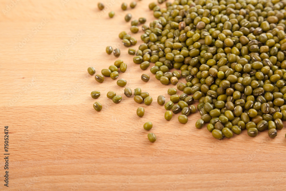 Mung beans on wood table Mung beans on wood table