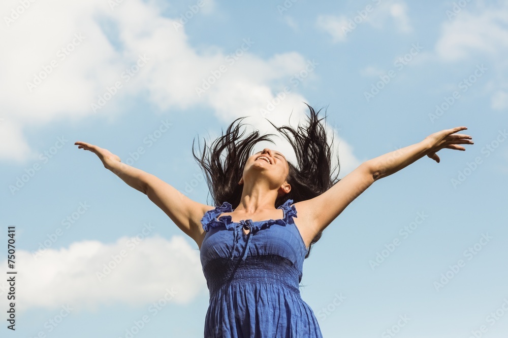 Pretty brunette in blue dress feeling free Pretty brunette in blue dress feeling free