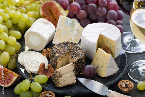 Assorted soft delicacy cheeses and appetizers to wine