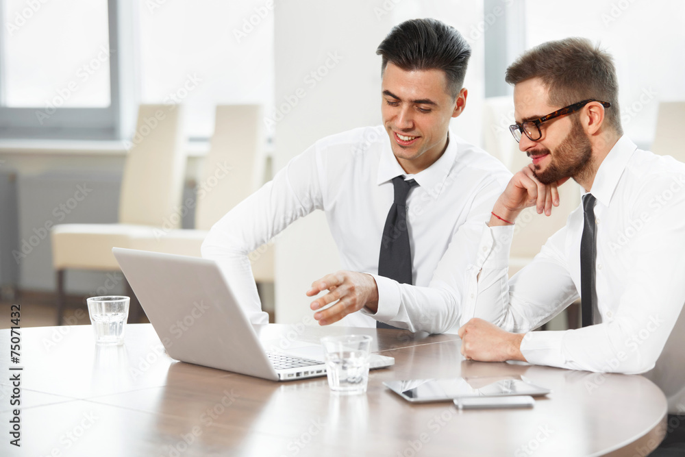 Business People. Successful business partners discuss project. T Business People. Successful business partners discuss project. T