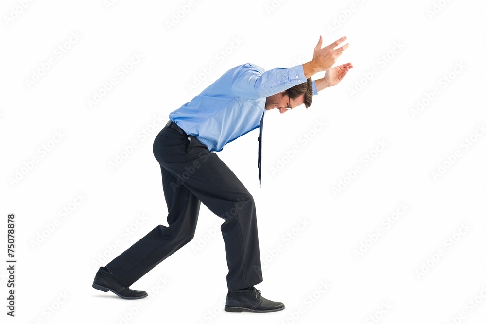 Naklejka premium Businessman standing and pushing up