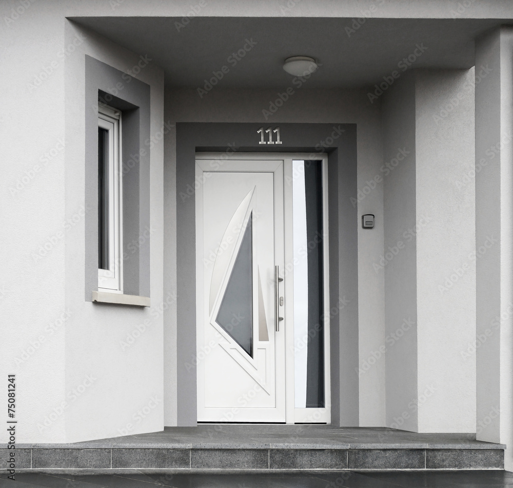 Moderner Eingang eines Neubaus in grau - obrazy, fototapety, plakaty 