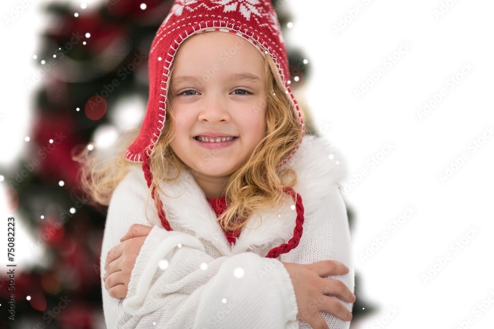 Composite image of festive little girl in hat and scarf Composite image of festive little girl in hat and scarf