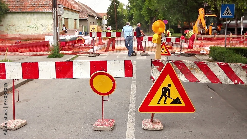 Reconstuction Sign Road signs in a street, under reconstruction symbol vídeo do Stock ...