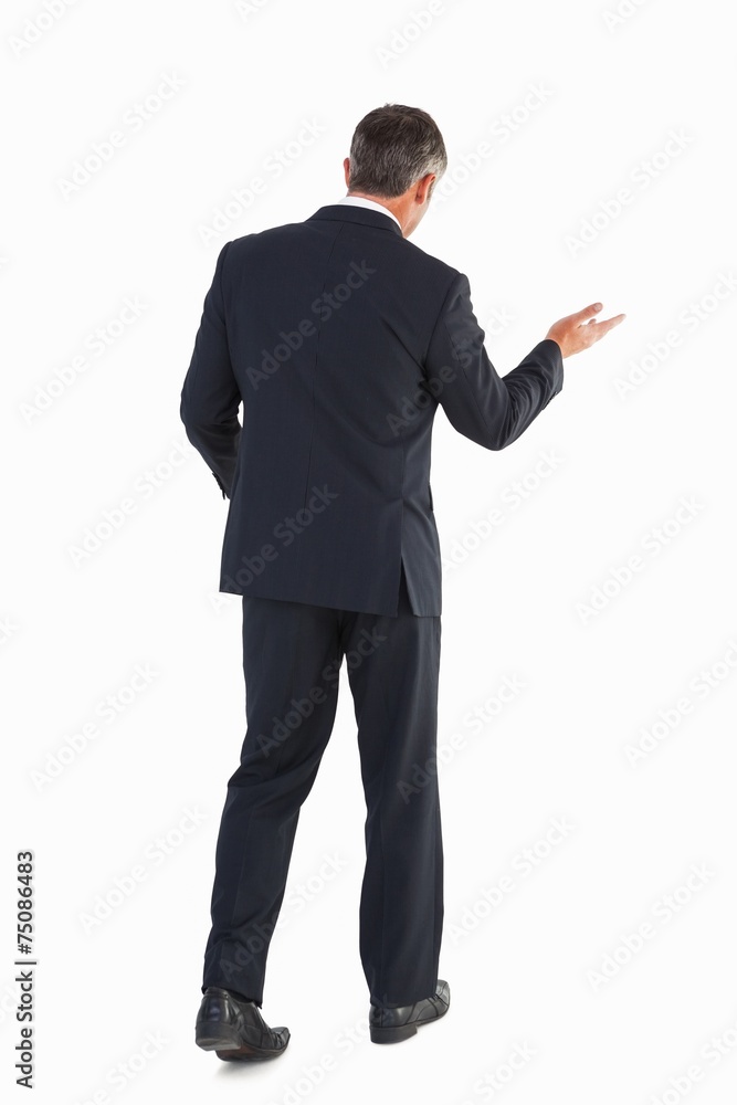 Businessman walking and doing gesture Businessman walking and doing gesture