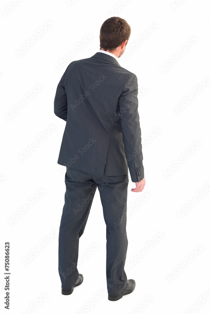 Businessman standing and looking Businessman standing and looking