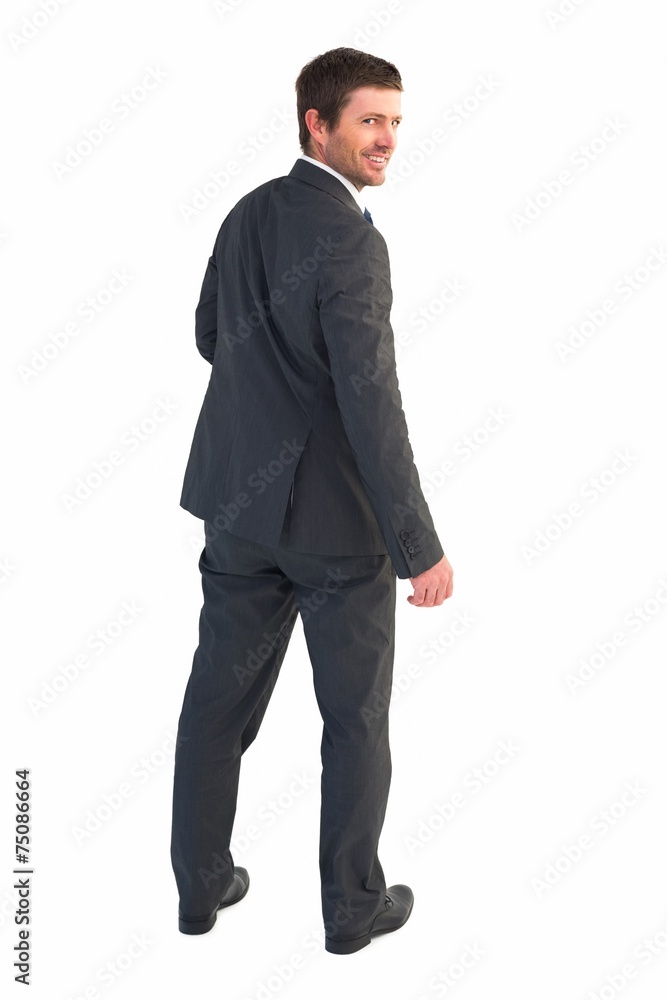 Businessman standing and smiling Businessman standing and smiling