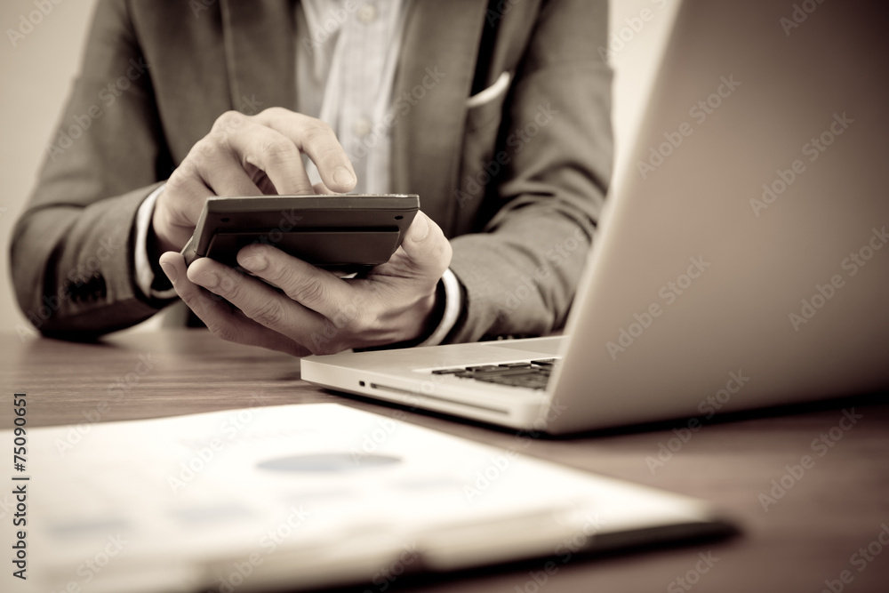 Businessman analyzing investment charts with laptop. Accounting Businessman analyzing investment charts with laptop. Accounting