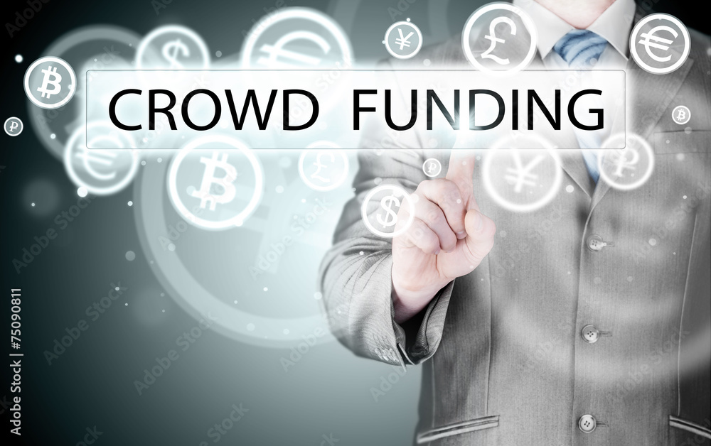 Businessman pushes virtual crowd funding button Businessman pushes virtual crowd funding button
