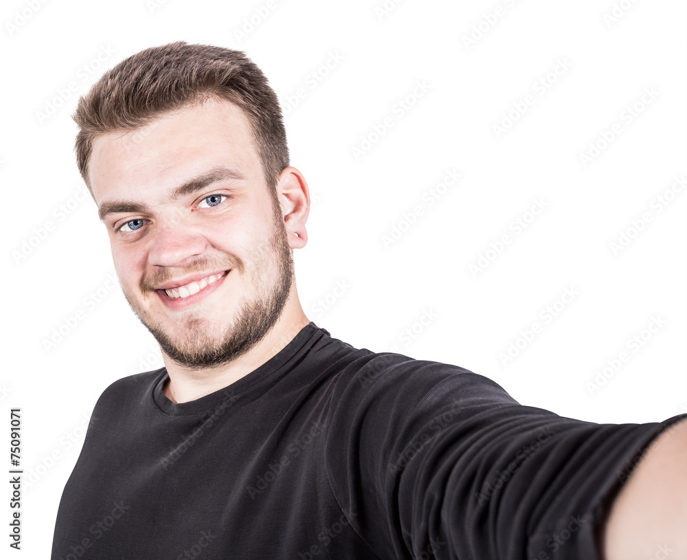 Happy young man taking a selfie photo on white background Happy young man taking a selfie photo on white background