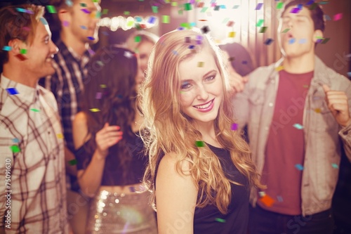 Composite image of stylish blonde smiling at camera